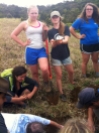 Alli Webster digs a 50 cm deep hole in the ground while Abby Kelley embraces her love of dirt.